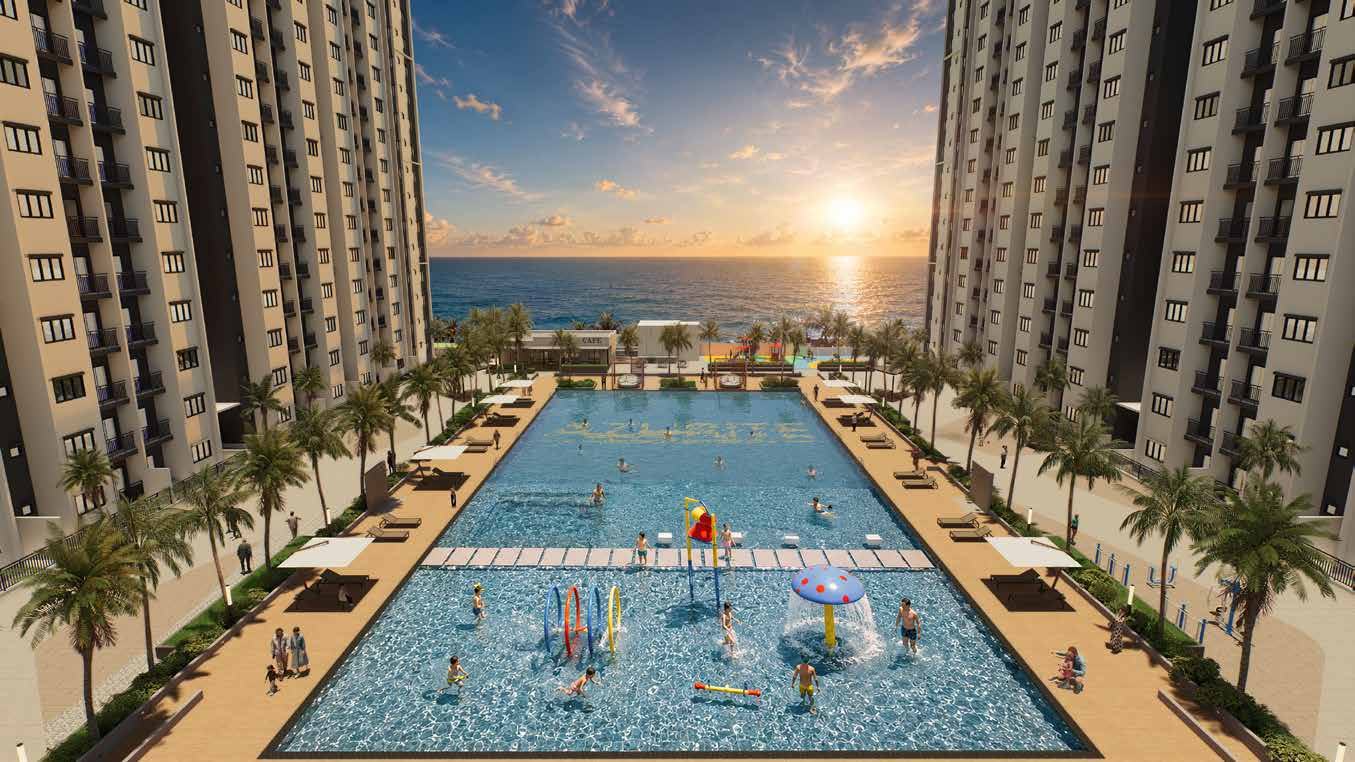 The Grand Azure Pool at sunset, framed by both towers and opening to the sea