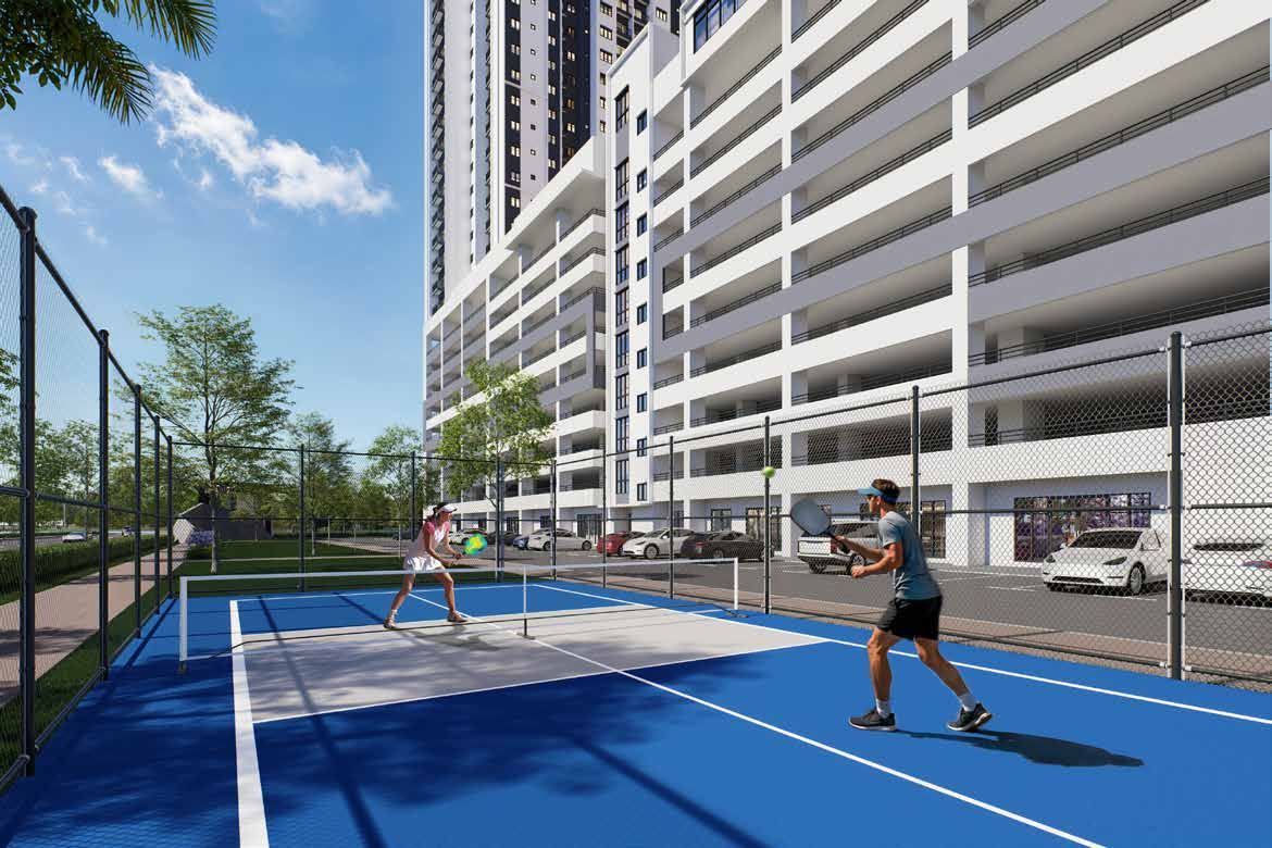 Two people playing on the blue pickleball court